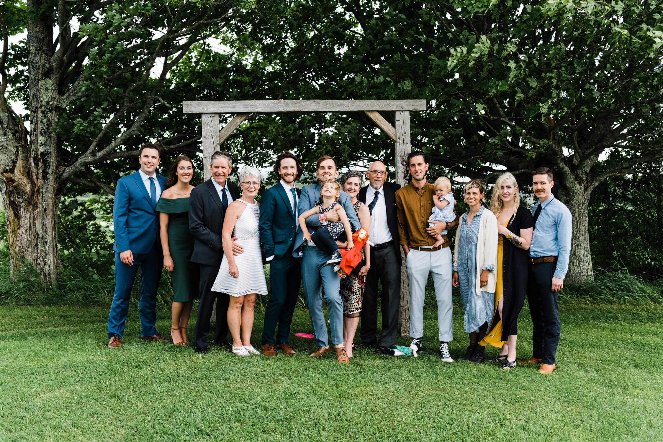family poses for photo at wedding