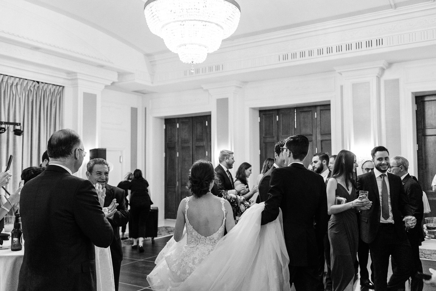 bride and groom enter wedding reception at lord nelson hotel