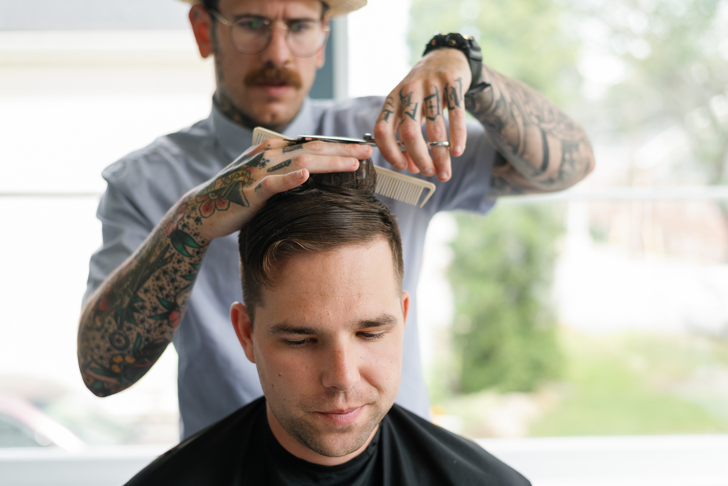 groom gets haircut before wedding