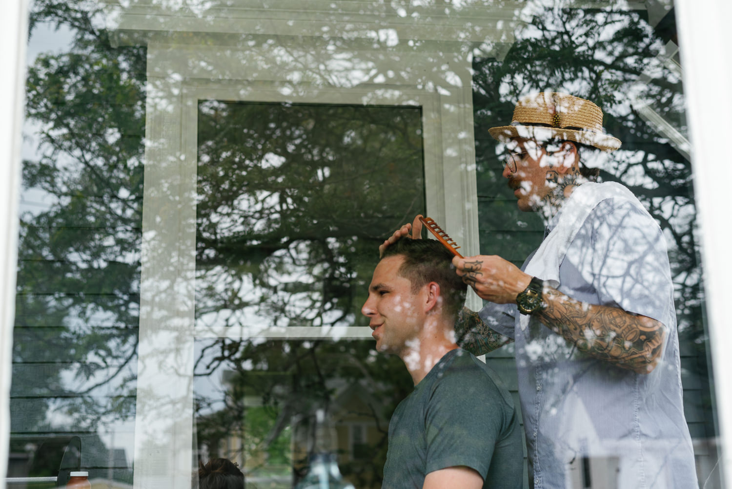 groom gets haircut before wedding