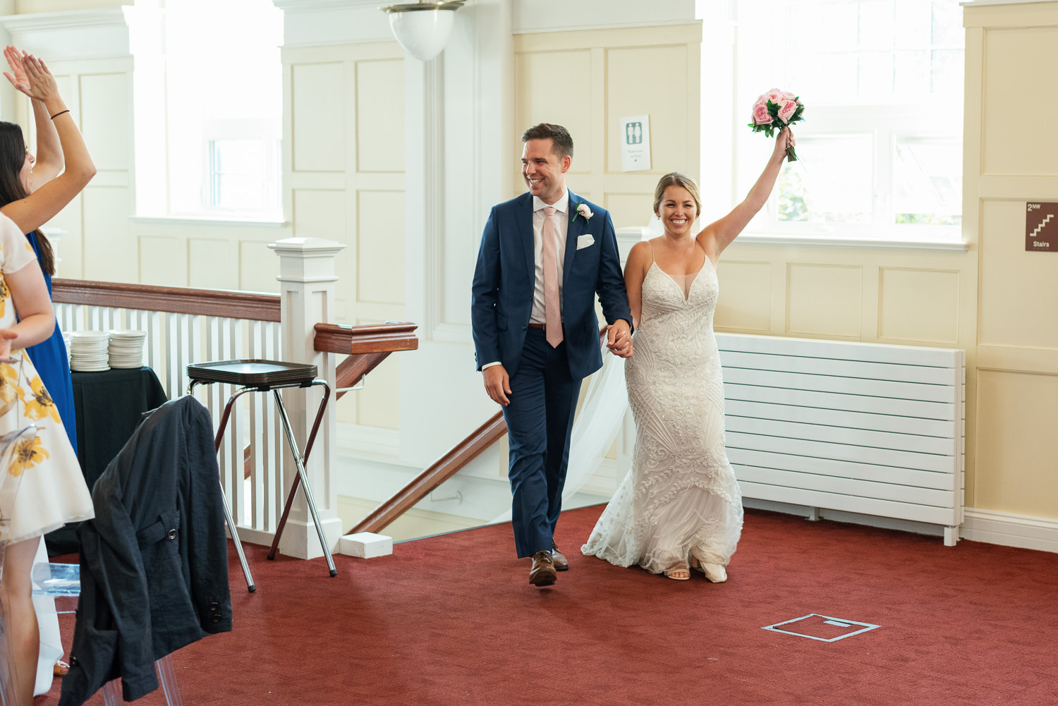 bride and groom enter wedding reception at acadia university