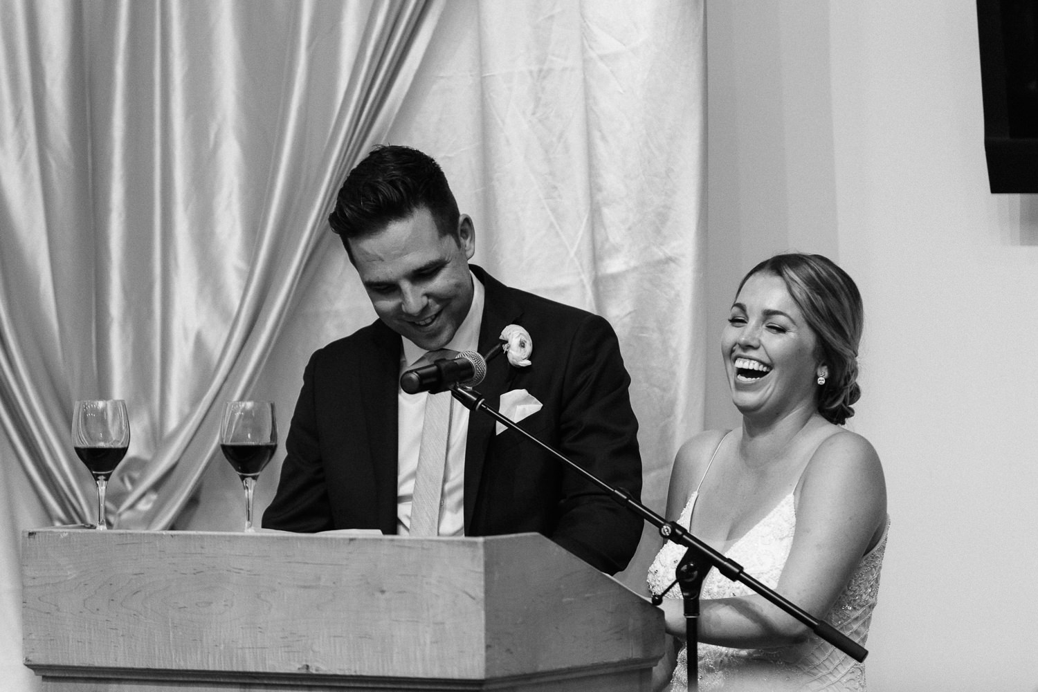 bride and groom make a speech during wedding reception at acadia university