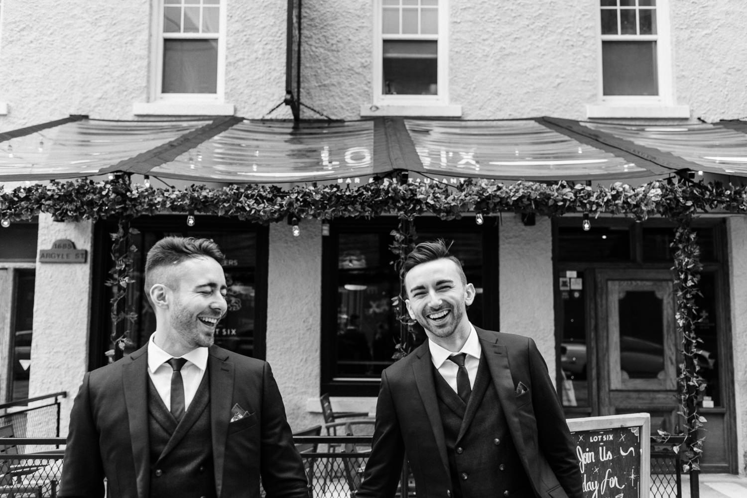 grooms pose for portraits in downtown halifax