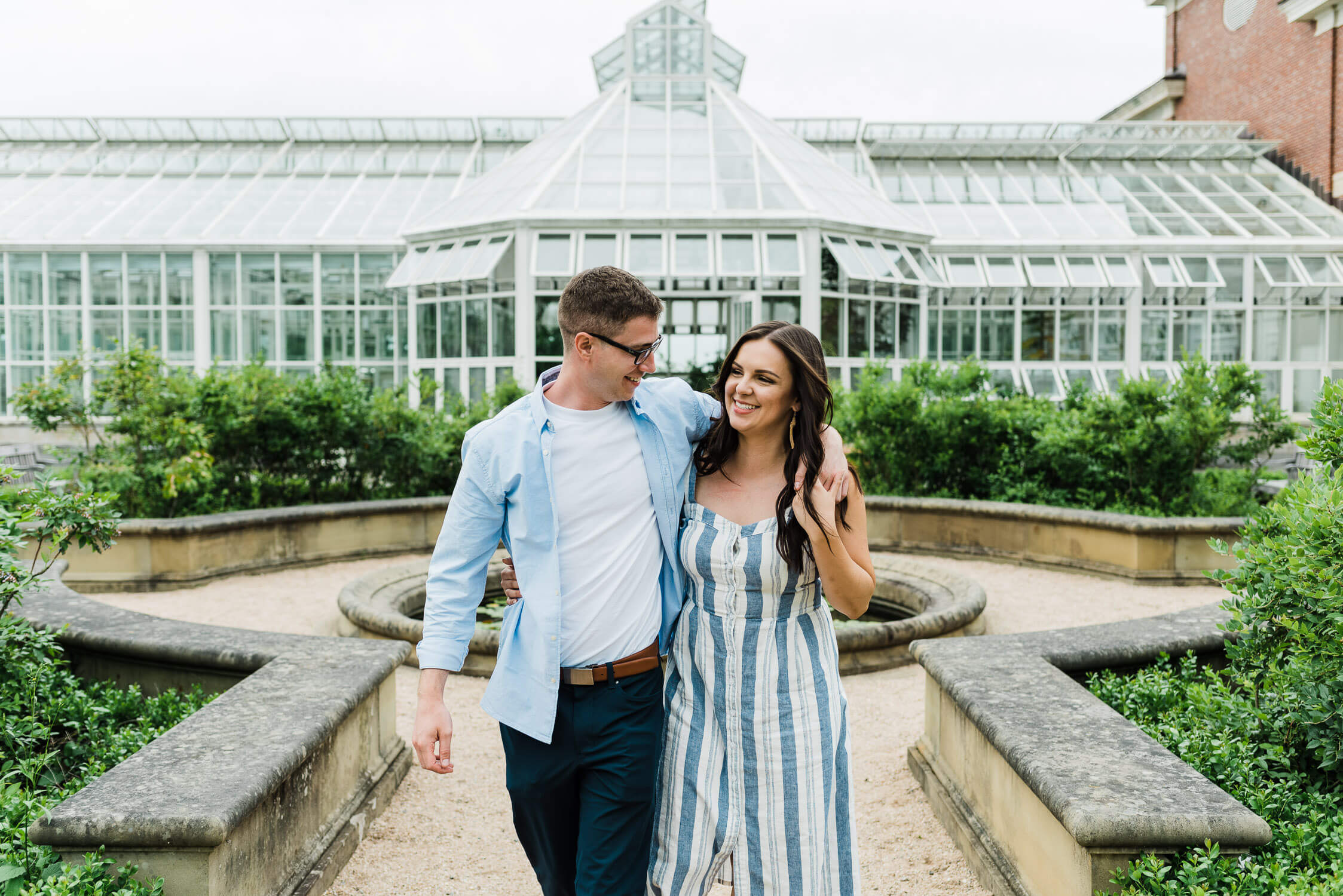 couple walk through Harriet Irving Gardens