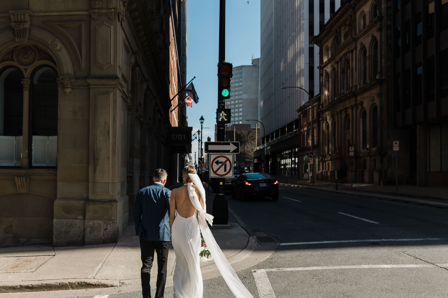 Bride and groom cross Halifax street