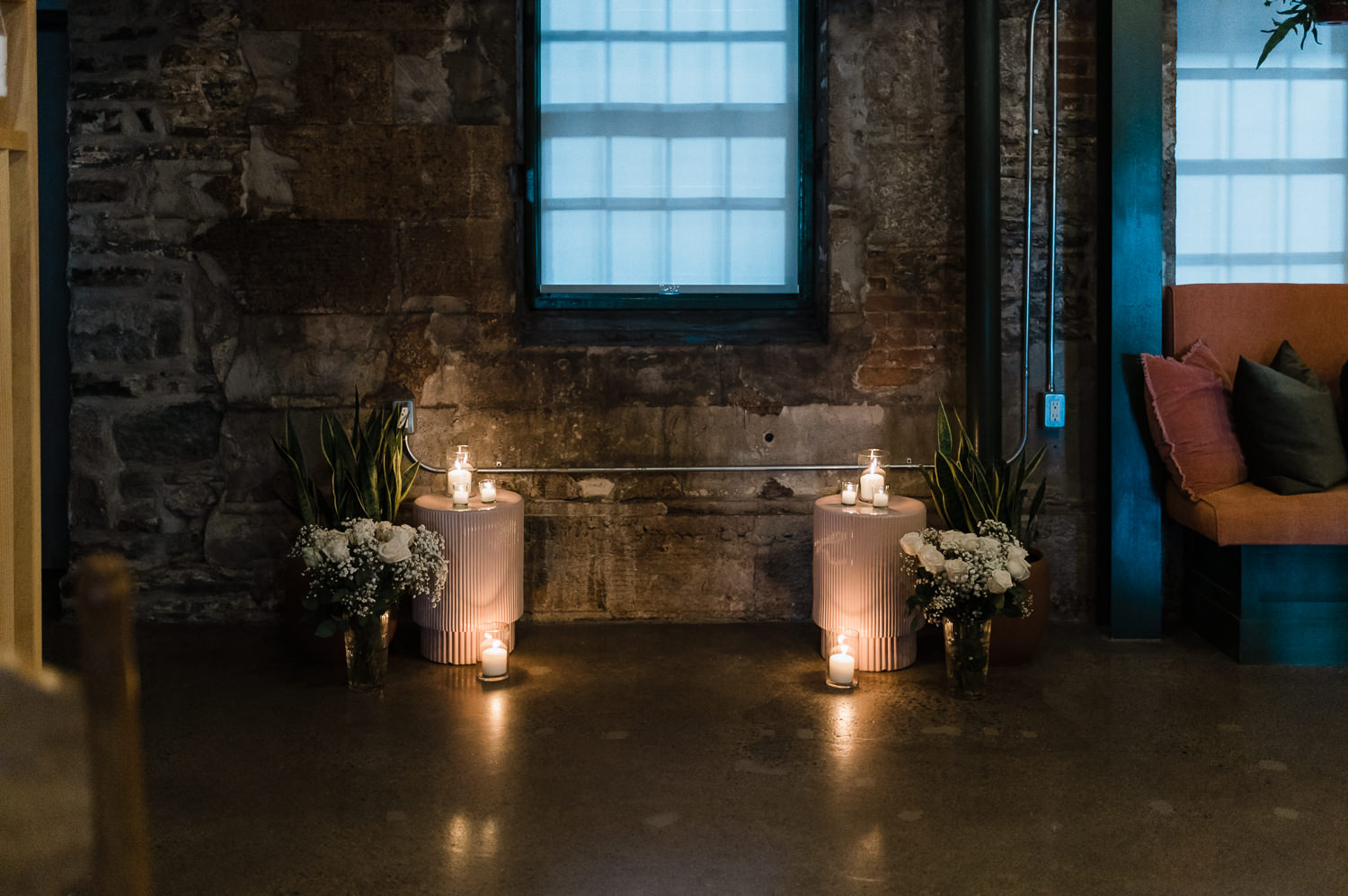 Ceremony setup with flowers and candles at Anemone Dining