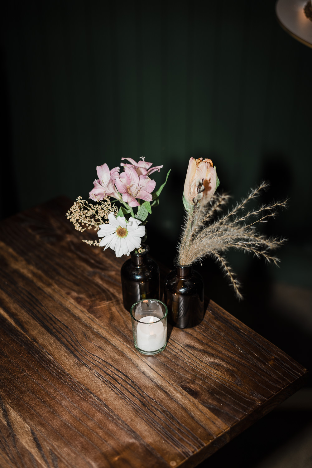 Flash photography of flowers setup on table at Anemone Dining wedding