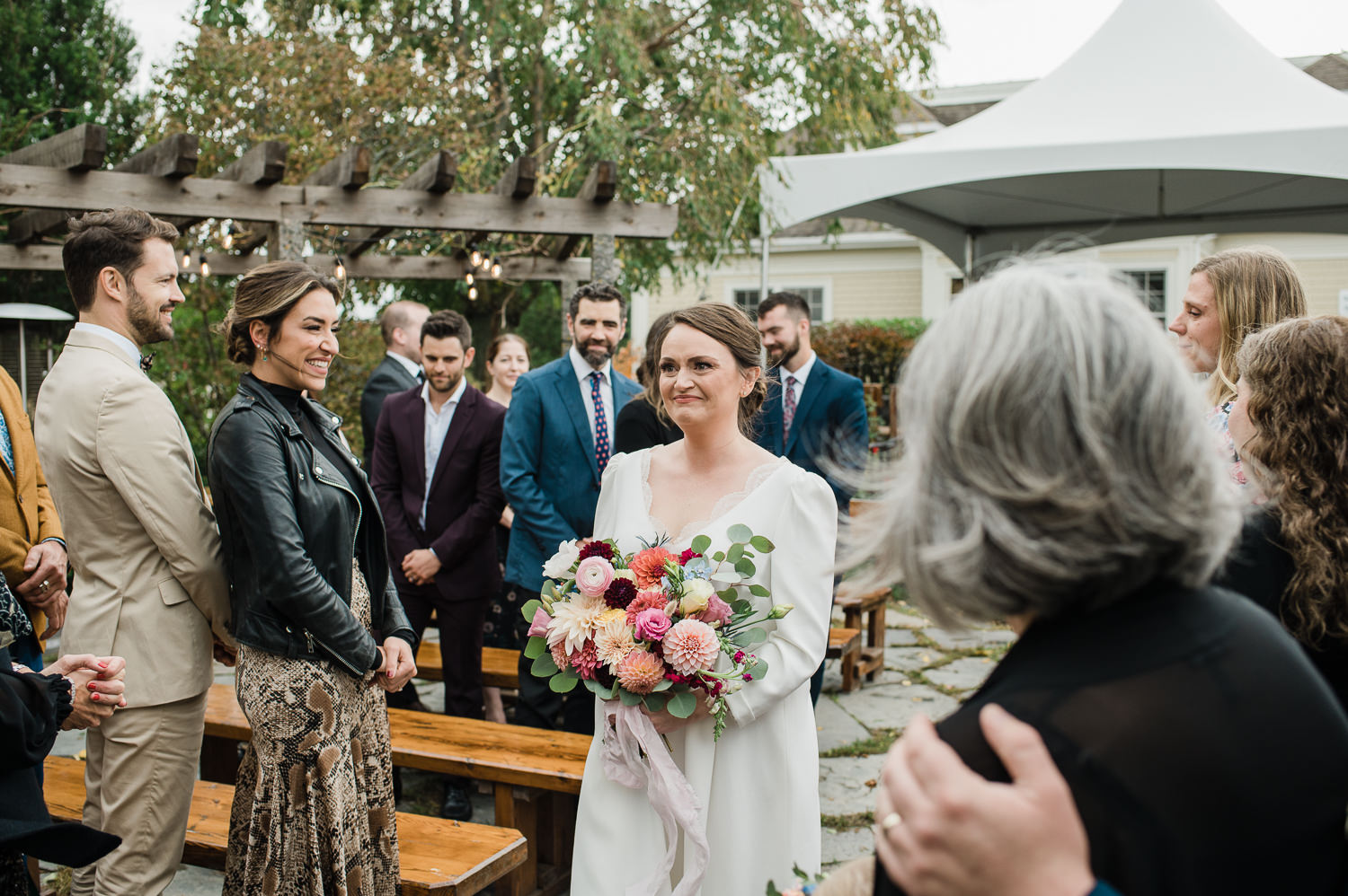 Bride walks down the ceremony aisle for Grand Pré Winery wedding