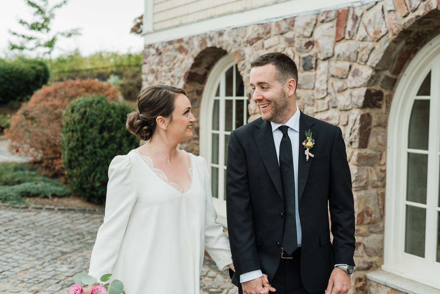 Bride and groom pose at Grand Pré Winery wedding