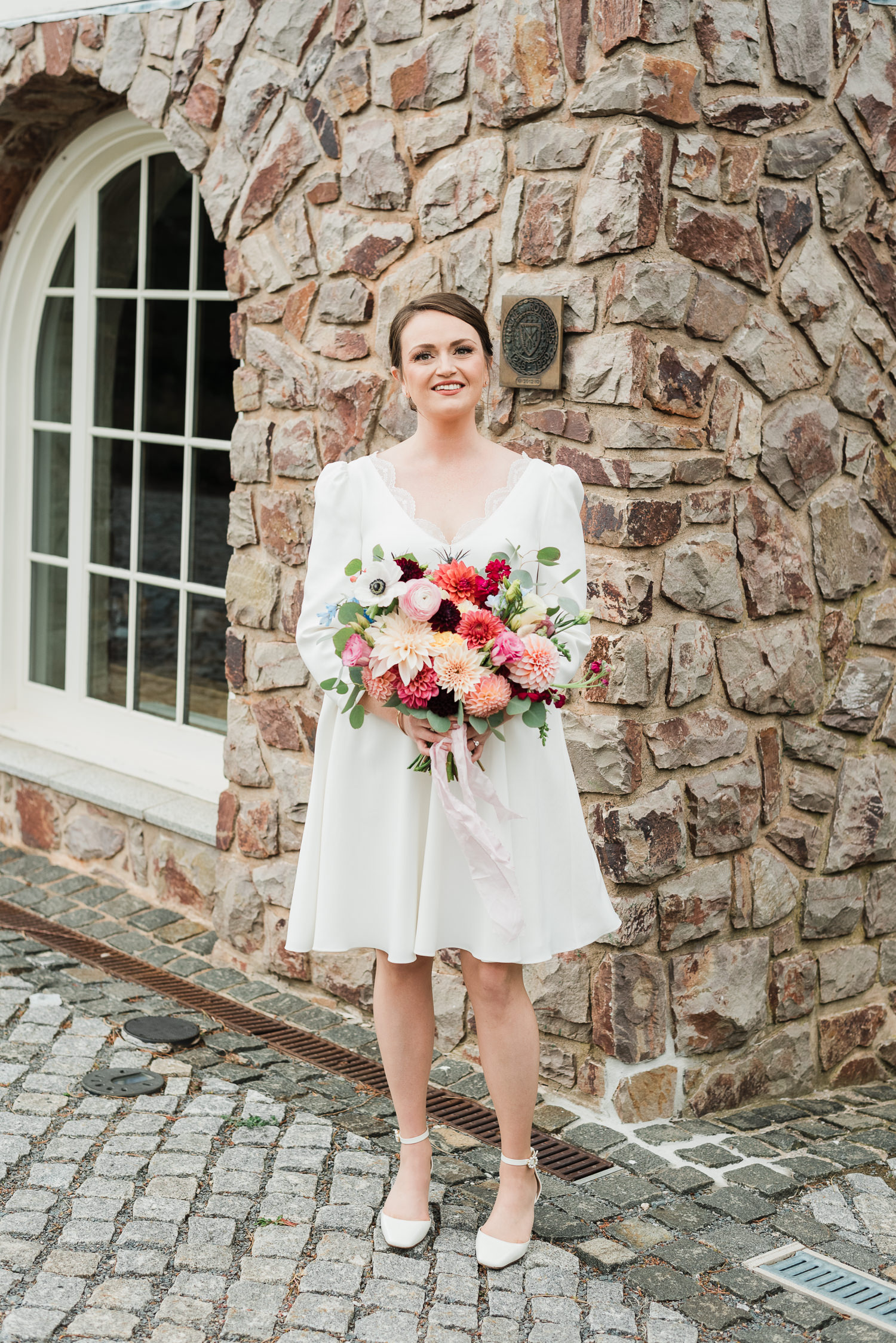 Bride holding flowers at Grand Pré Winery wedding