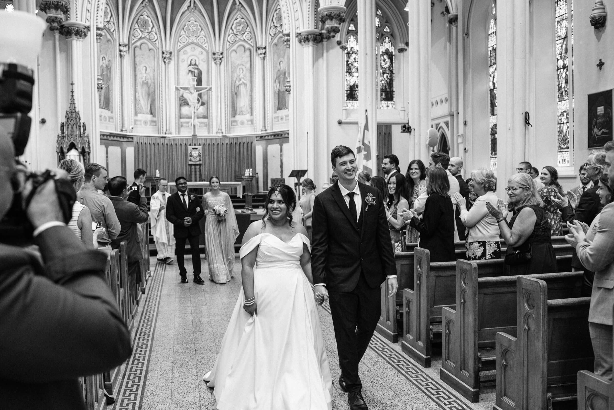 Bride and groom happily married at Saint Mary's Cathedral Basilica in Halifax