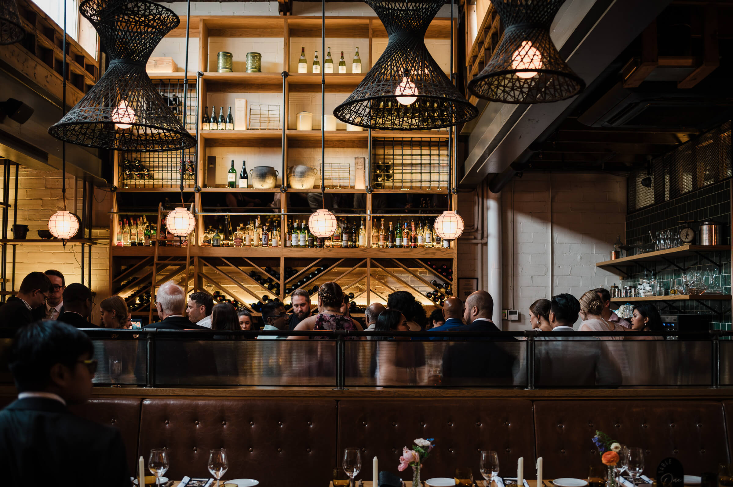 Guests at bar for wedding reception at Agricola Street Brasserie