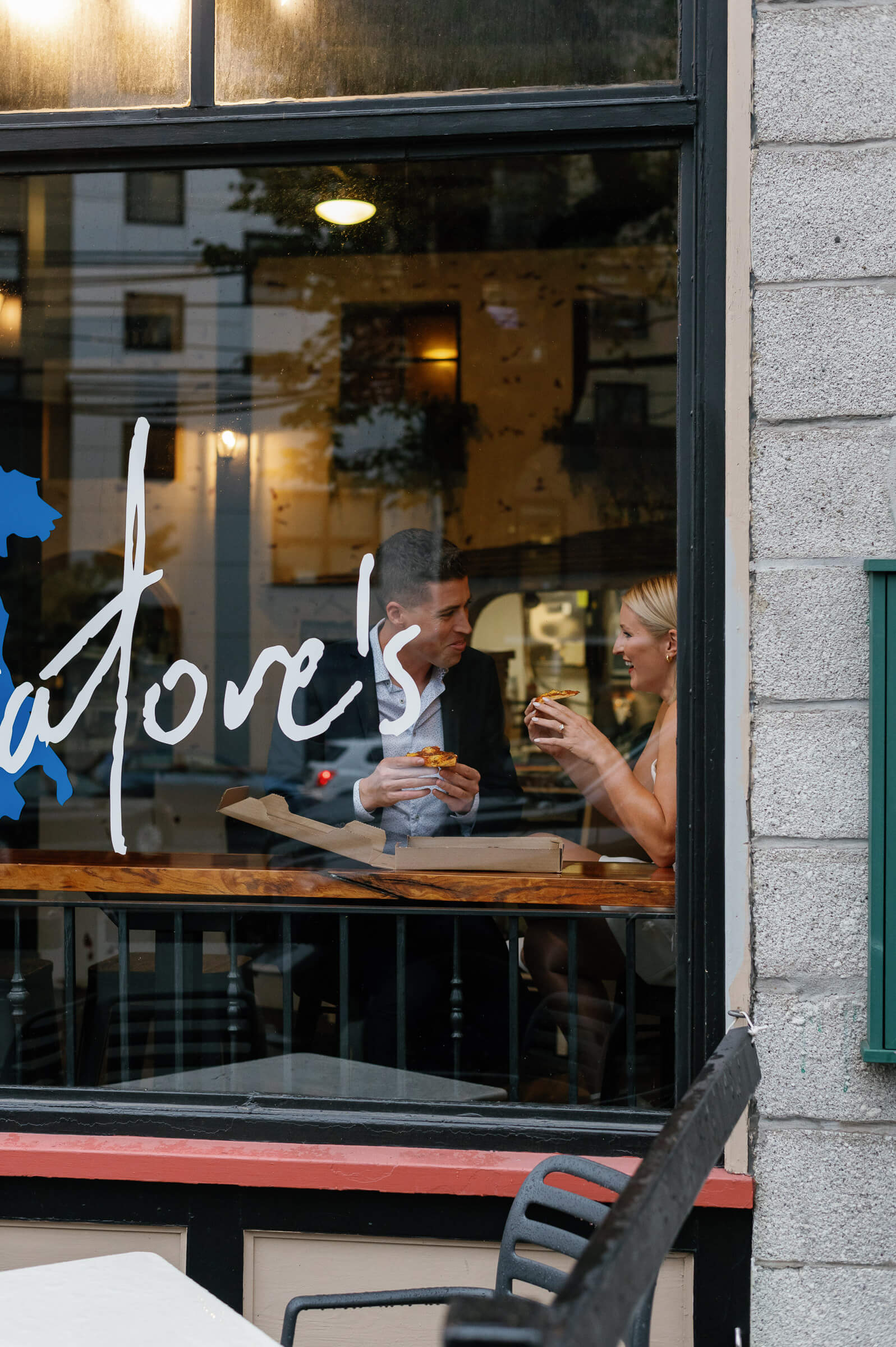 couple eat pizza at salvatore's halifax