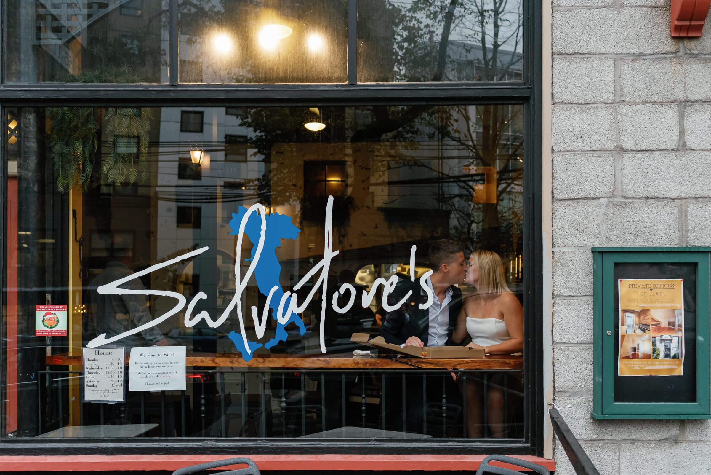 couple eat pizza at salvatore's halifax