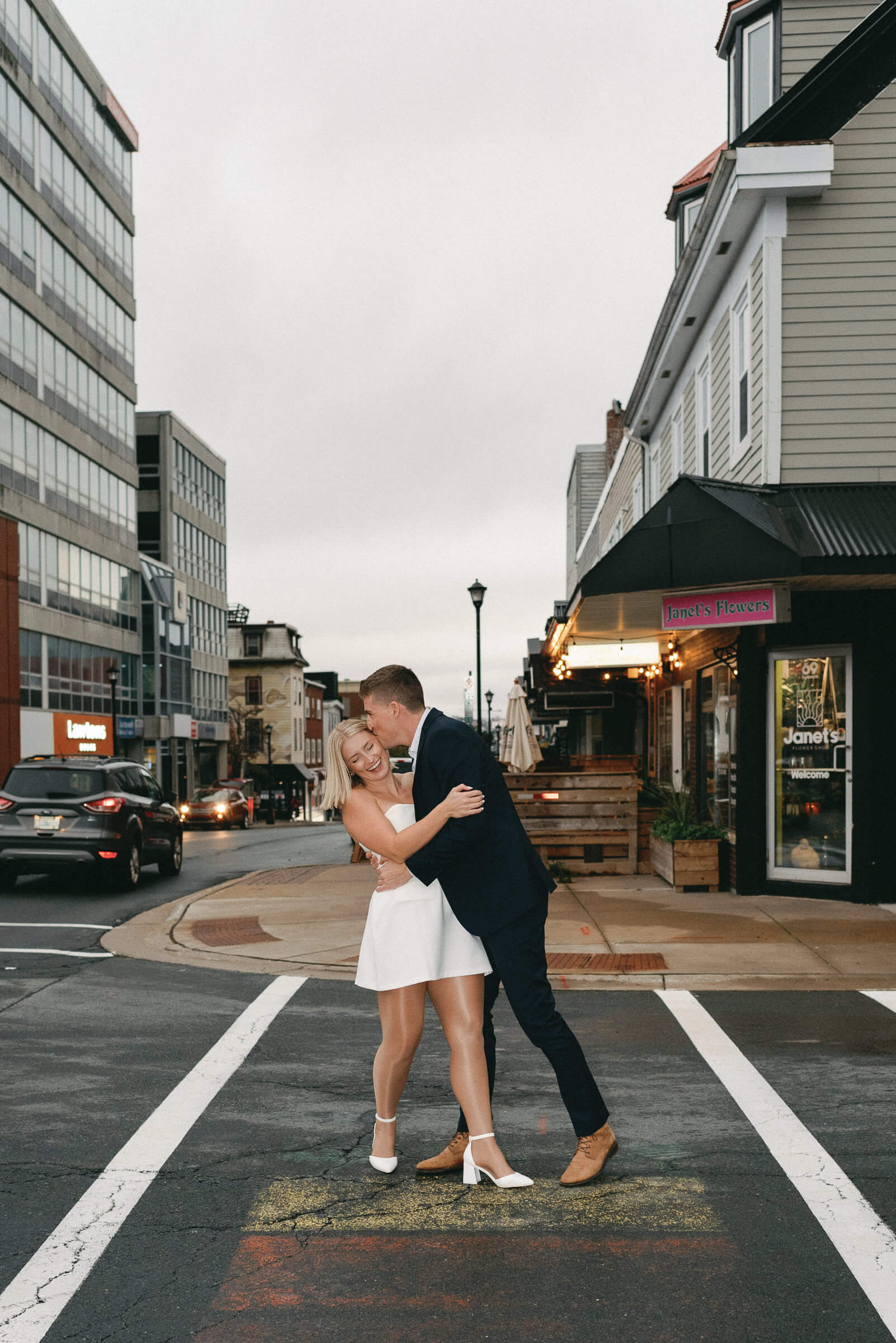 candid photograph of couple crossing dartmouth street
