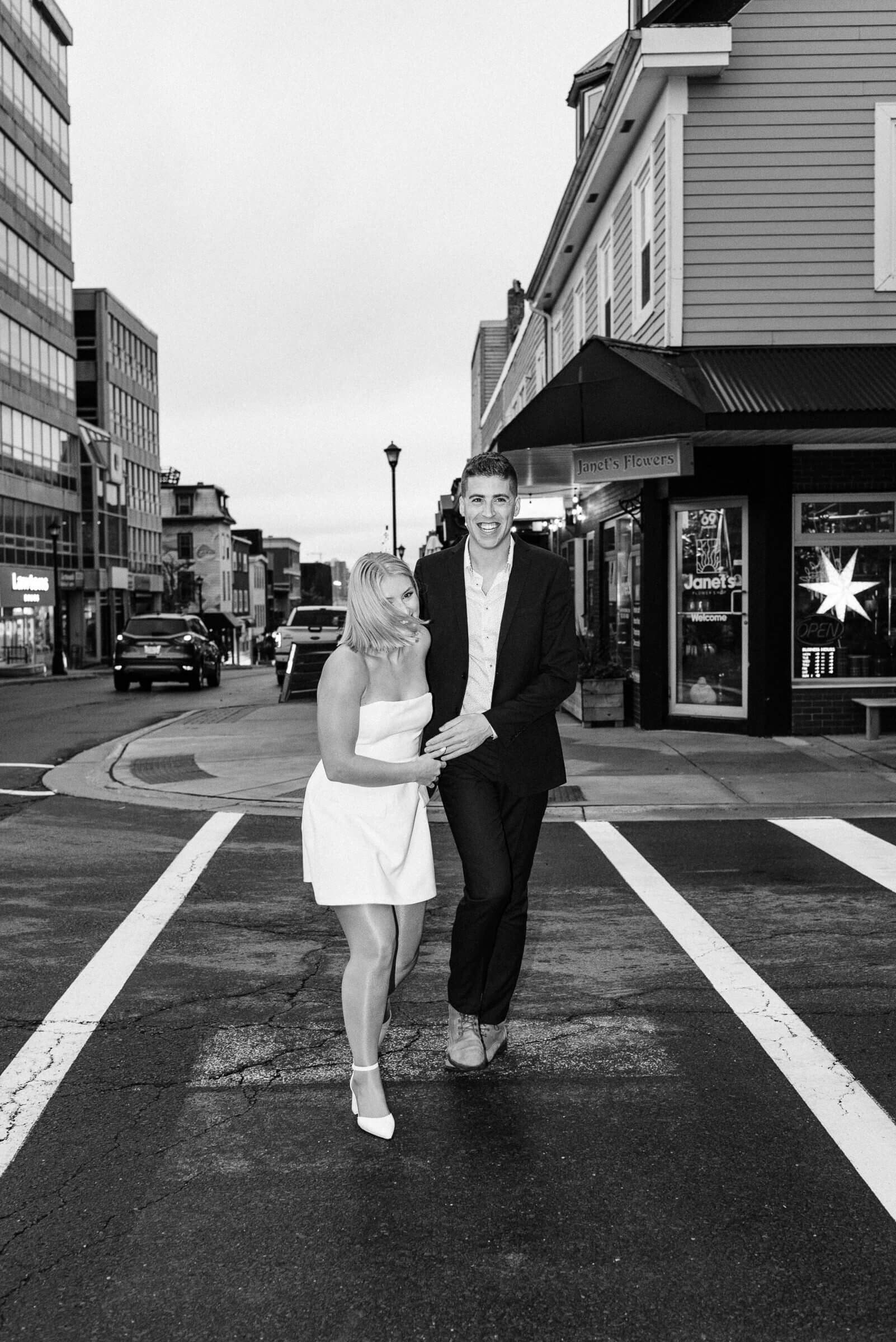 candid photograph of couple crossing dartmouth street