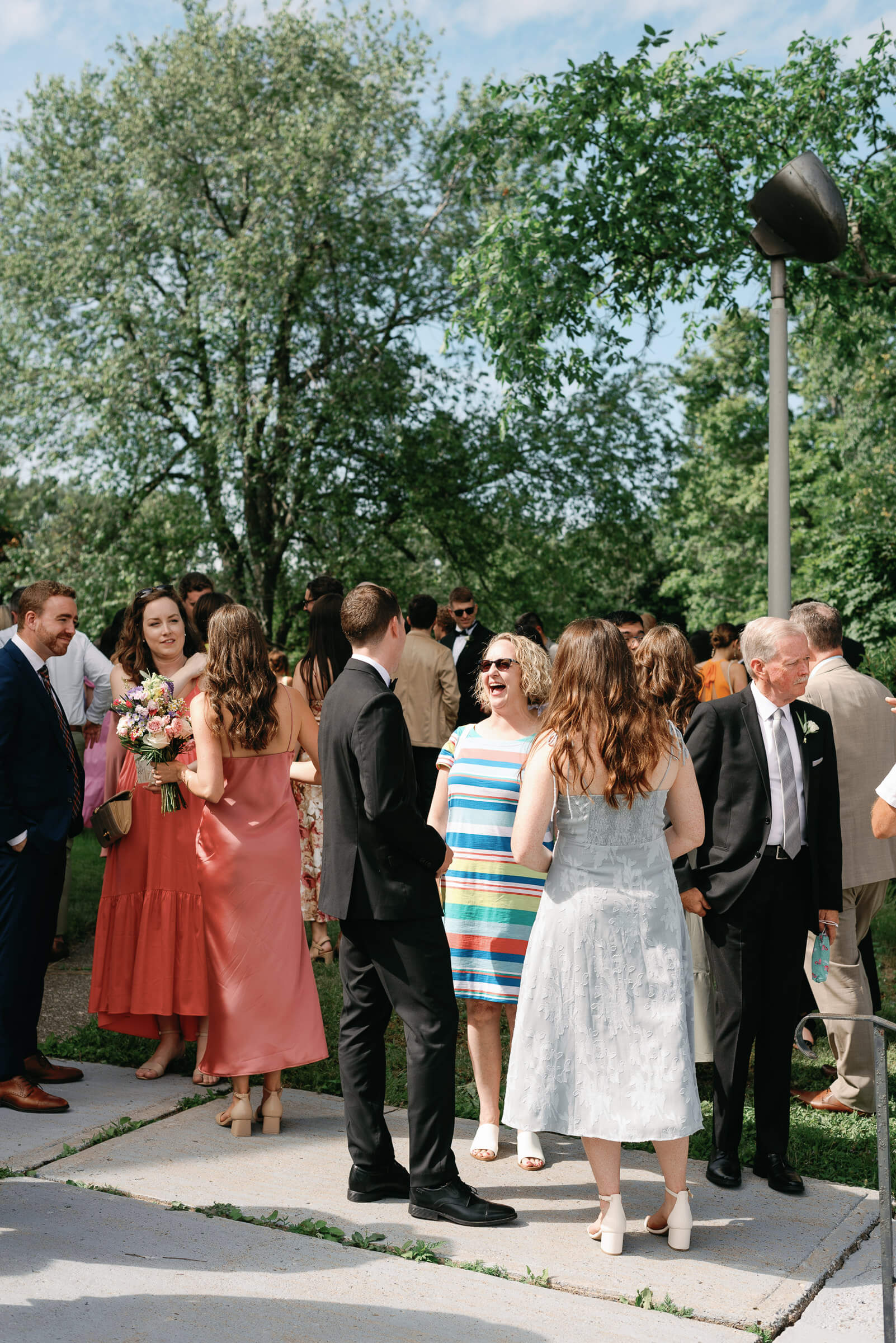 guests gather and celebrate outside church in new glasgow
