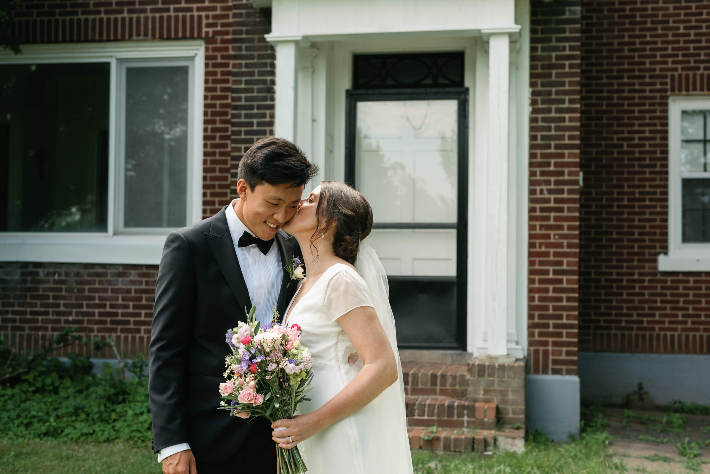 bride and groom pose for photos outside new glasgow church wedding