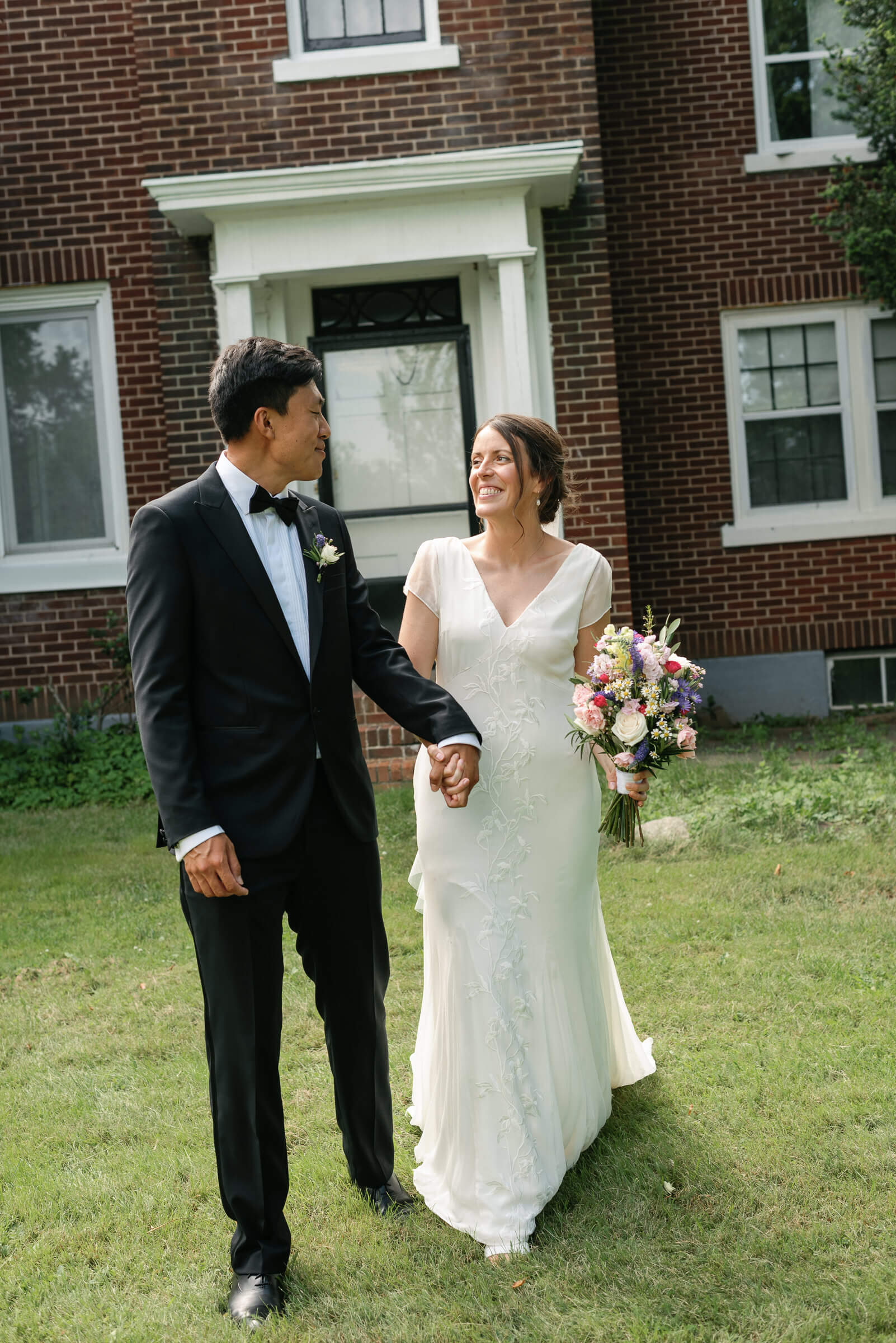 bride and groom pose for photos outside new glasgow church wedding