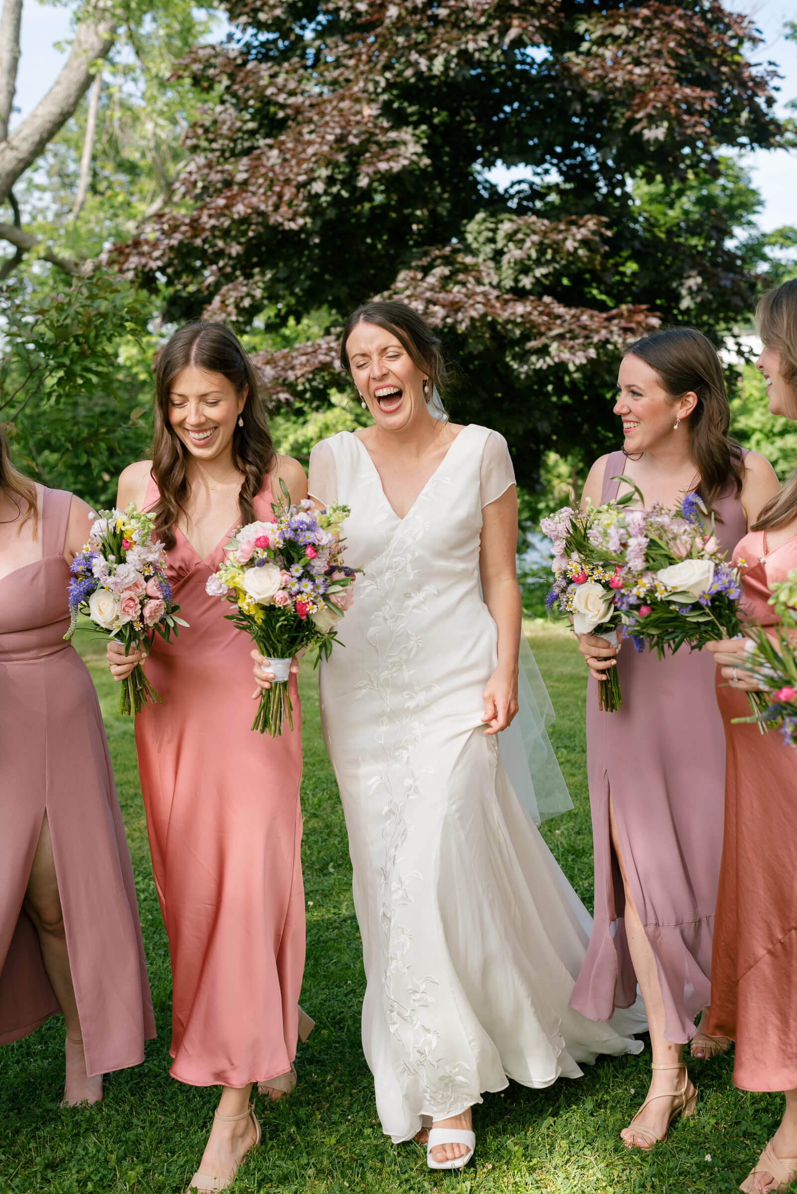 bridesmaids pose for photos in new glasgow park