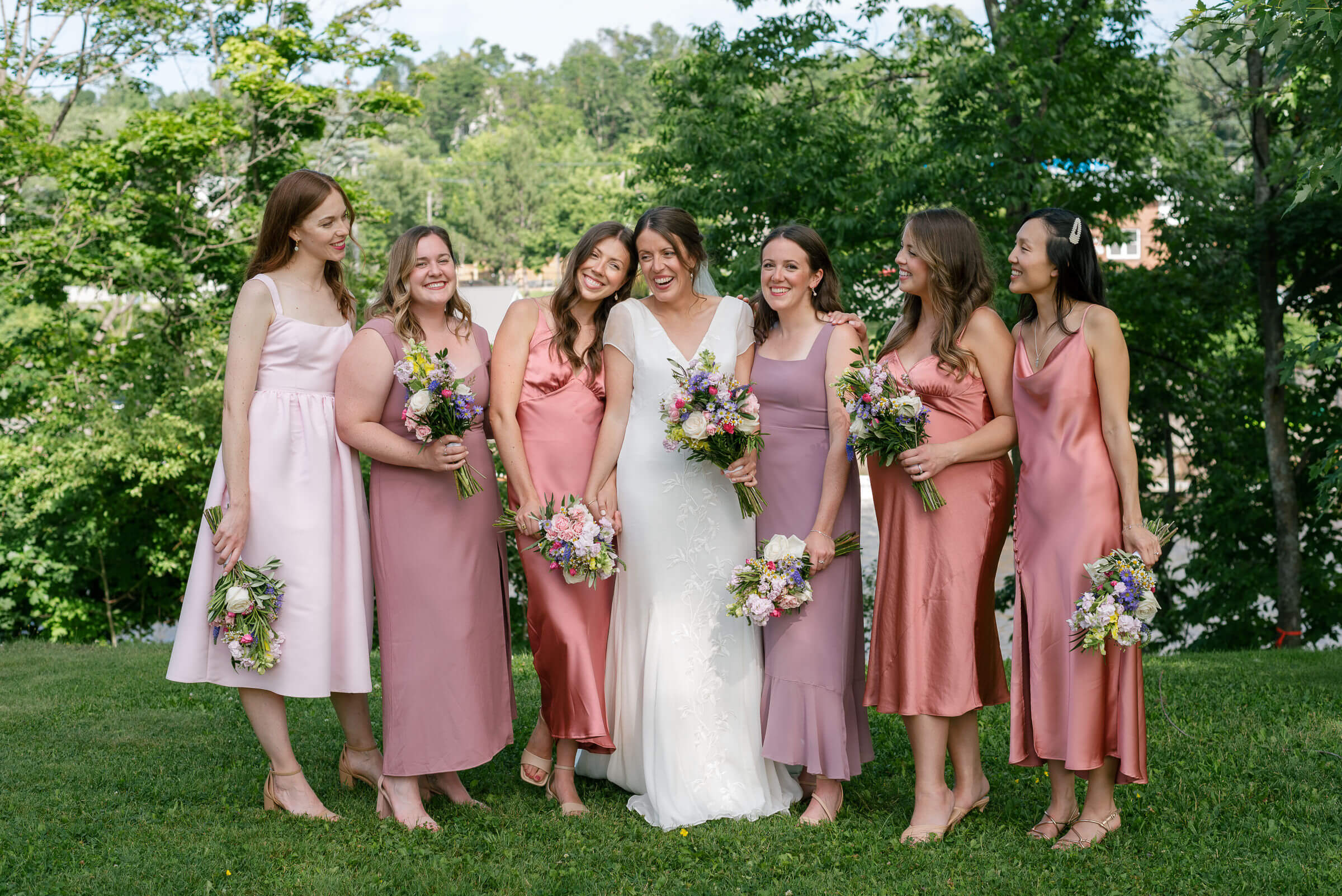 bridesmaids pose for photos in new glasgow park
