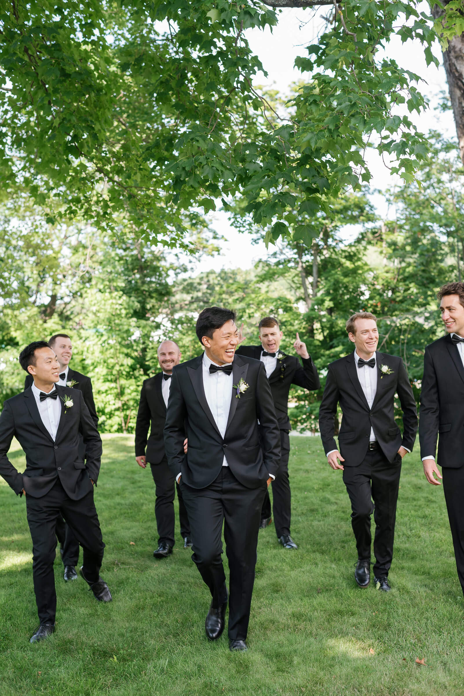 groomsmen pose for photos in new glasgow park