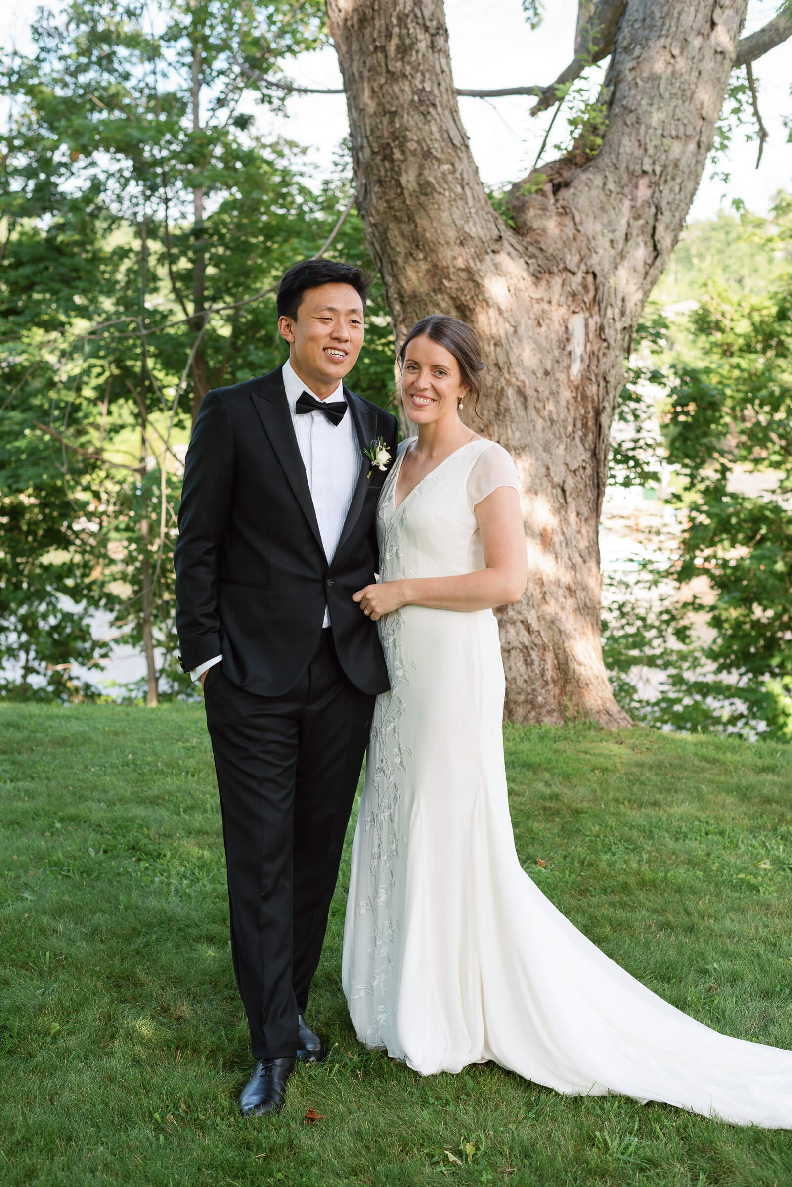 bride and groom pose for photos in new glasgow park