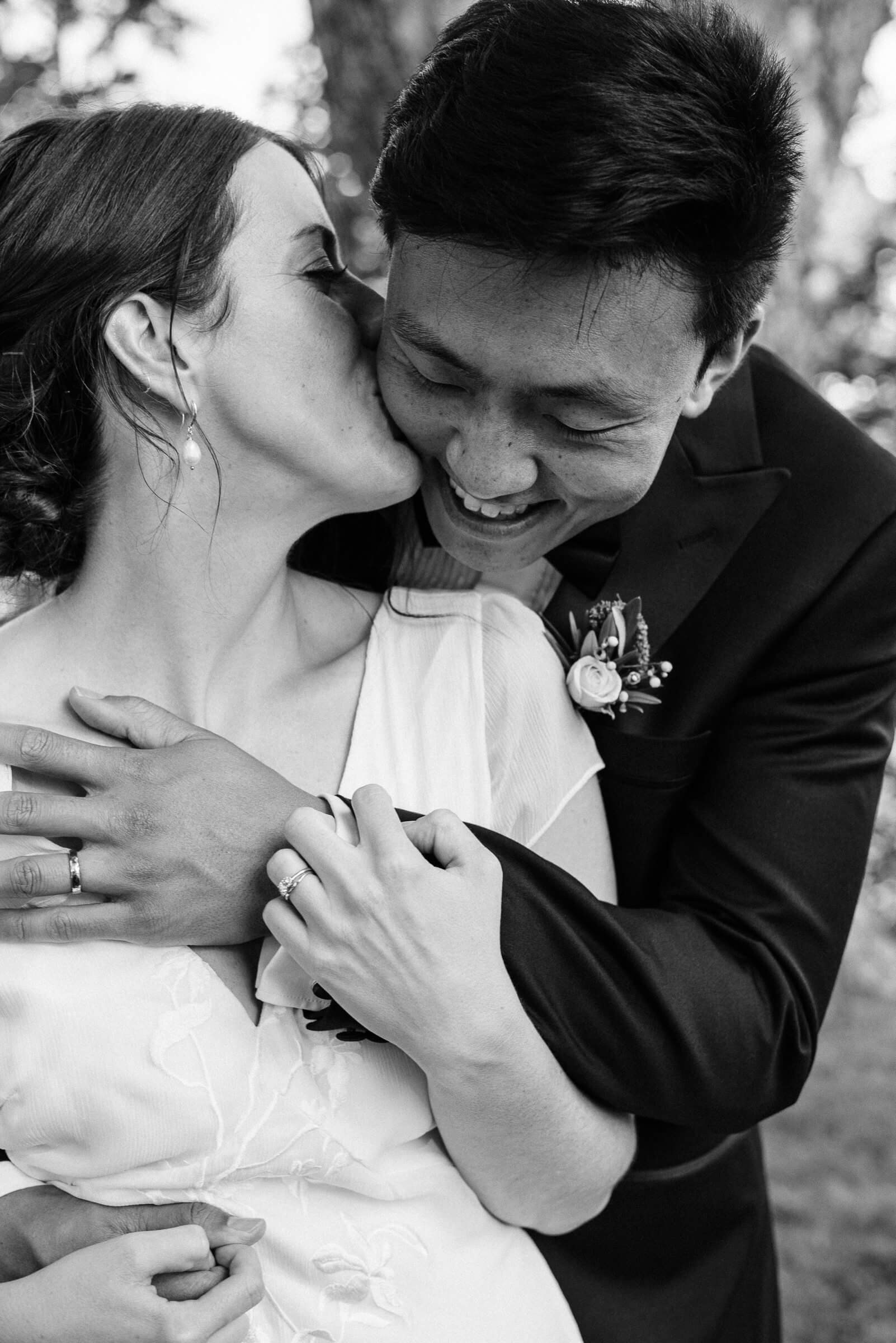 bride and groom pose for photos in new glasgow park