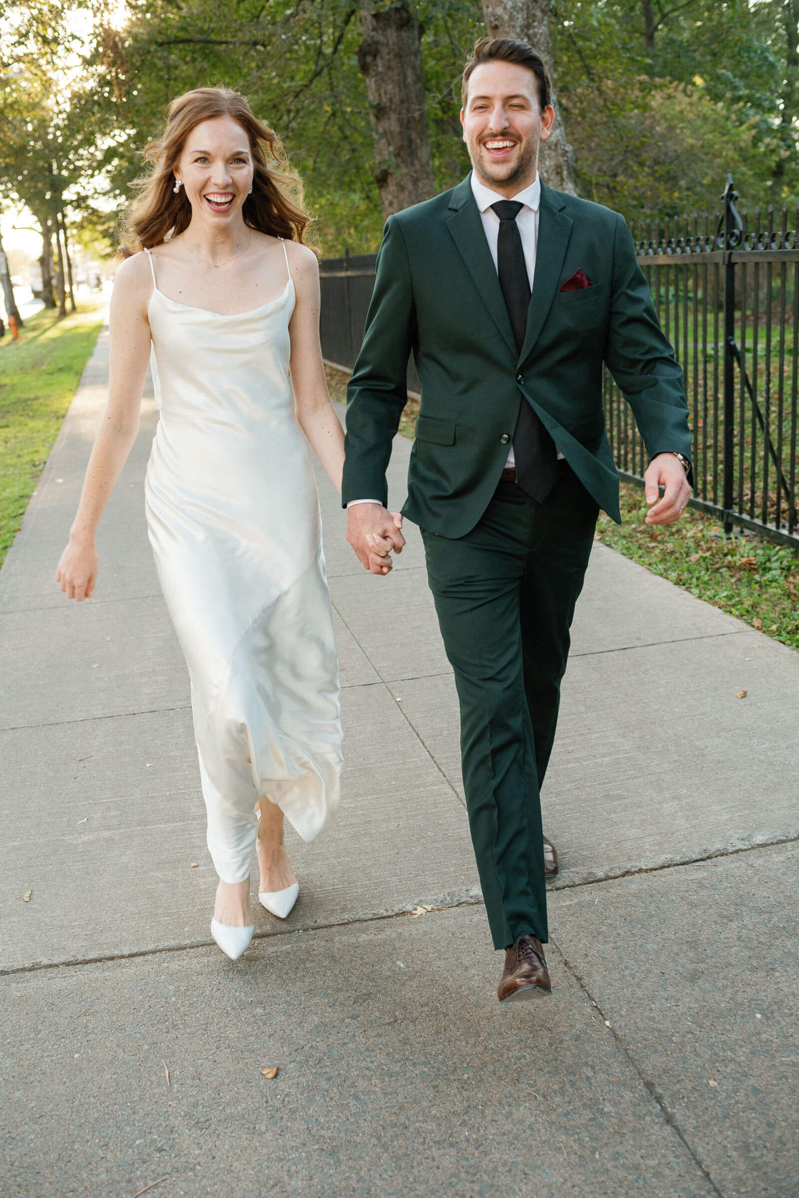 wedding couple strolls city street in halifax