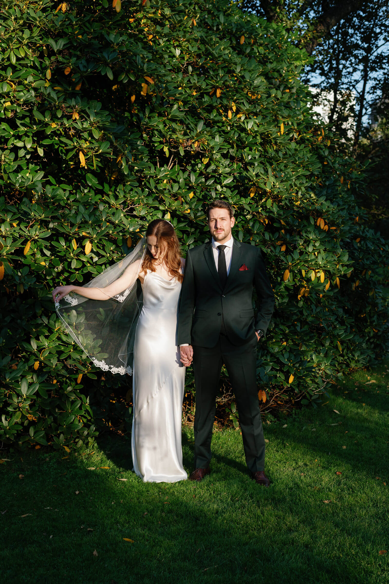 wedding couple pose for editorial style portrait in halifax public gardens