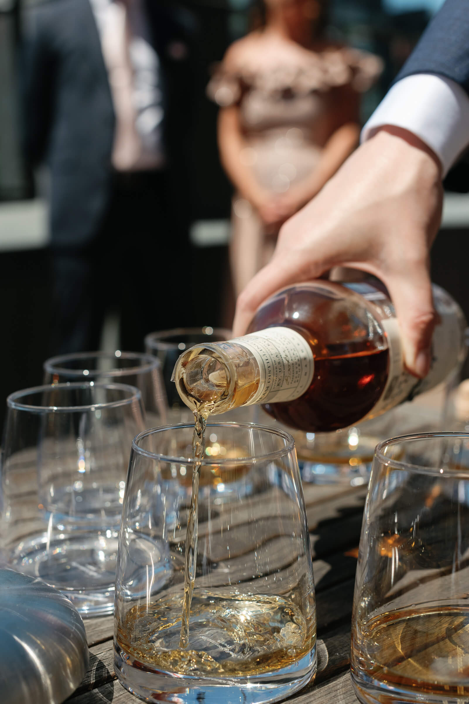 groomsmen enjoy a drink on the deck of the westin hotel