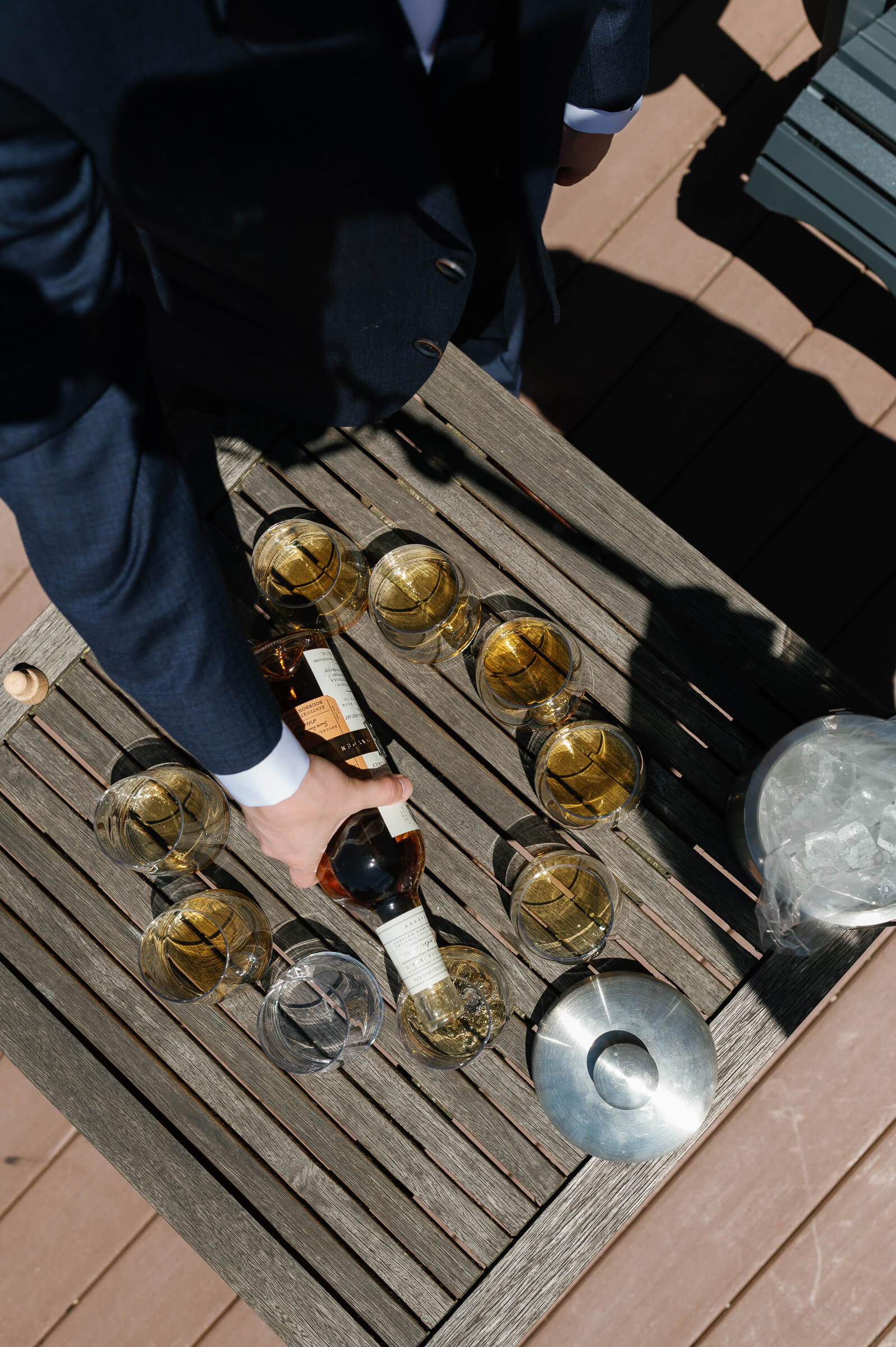 groomsmen enjoy a drink on the deck of the westin hotel