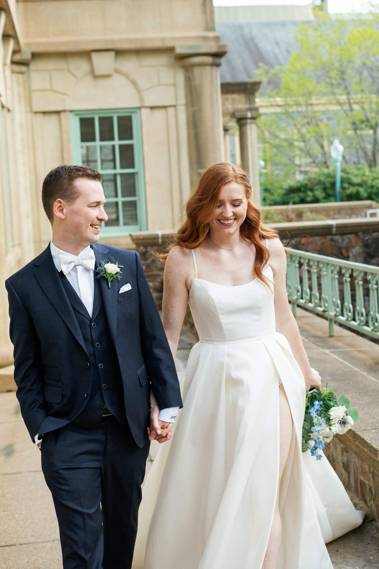 bride and groom pose for portraits at the king's college campus