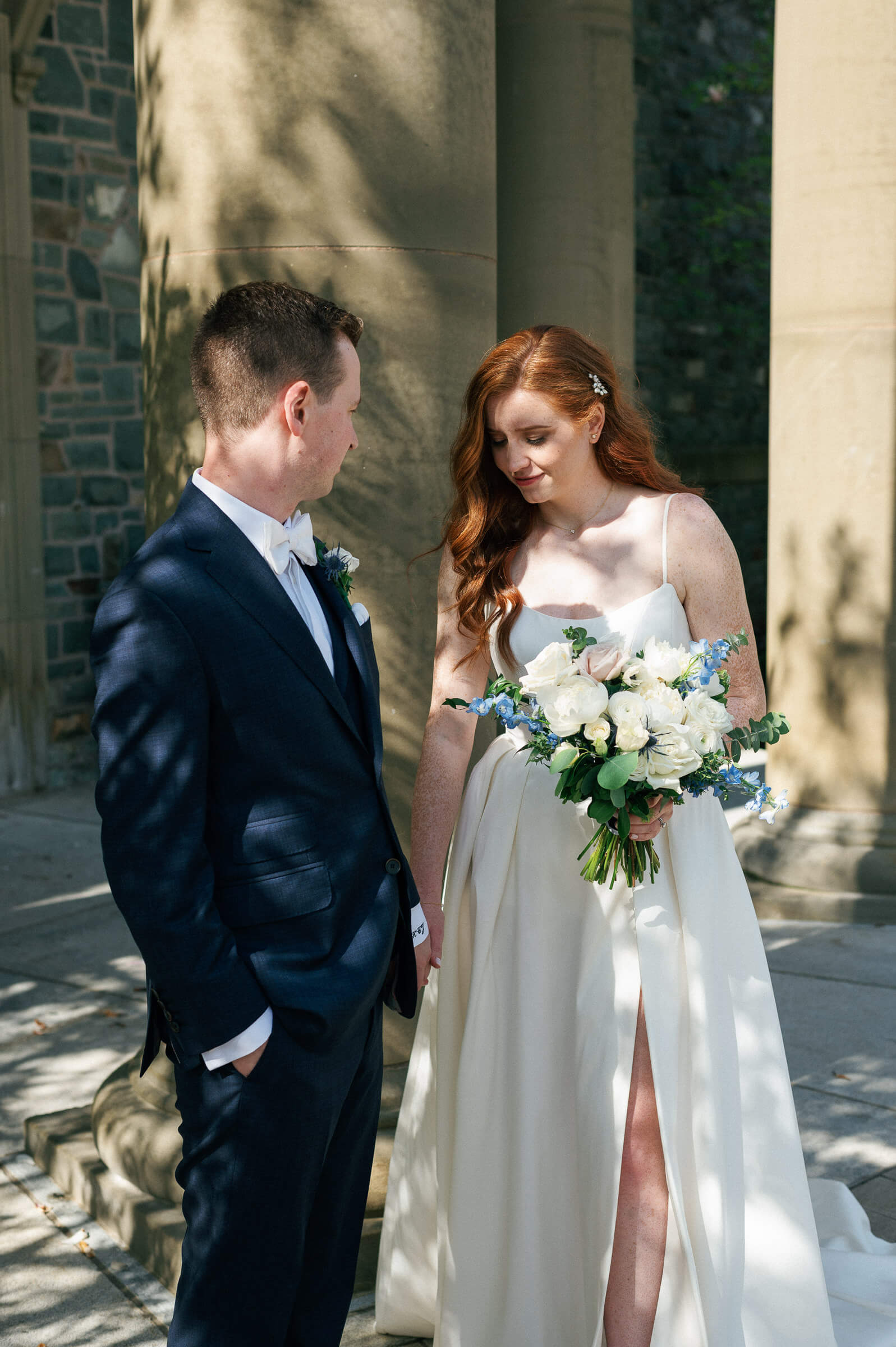 bride and groom pose for portraits at the king's college campus