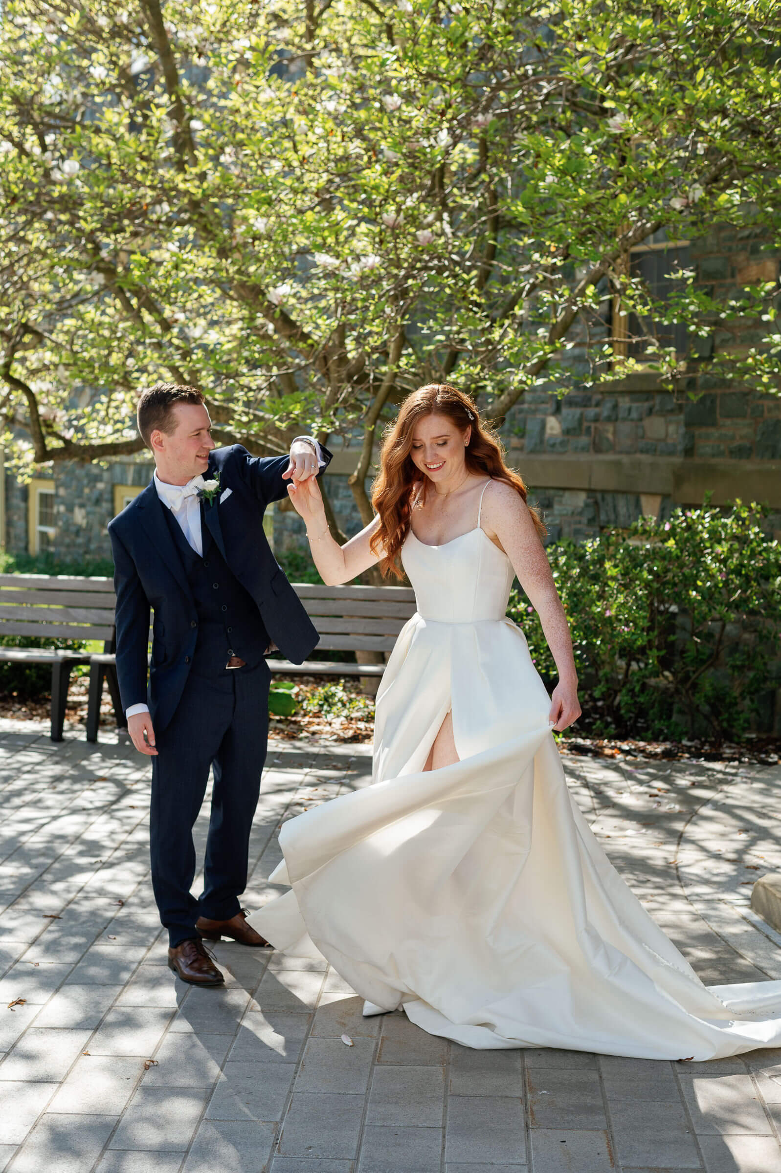 bride and groom pose for portraits at the king's college campus