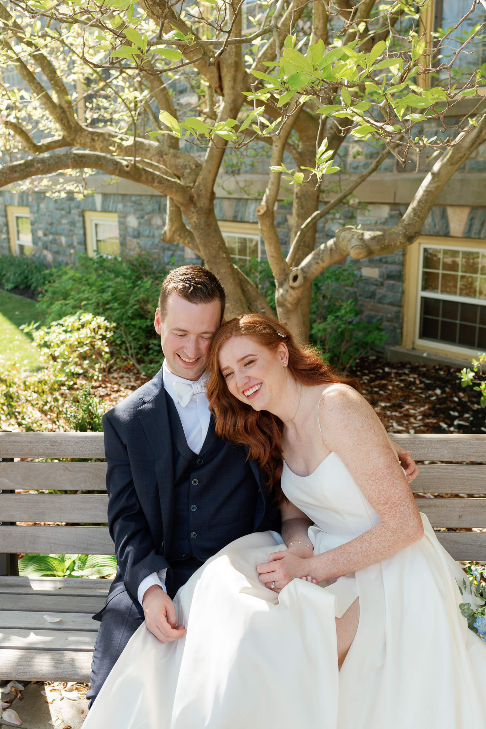 bride and groom pose for portraits at the king's college campus