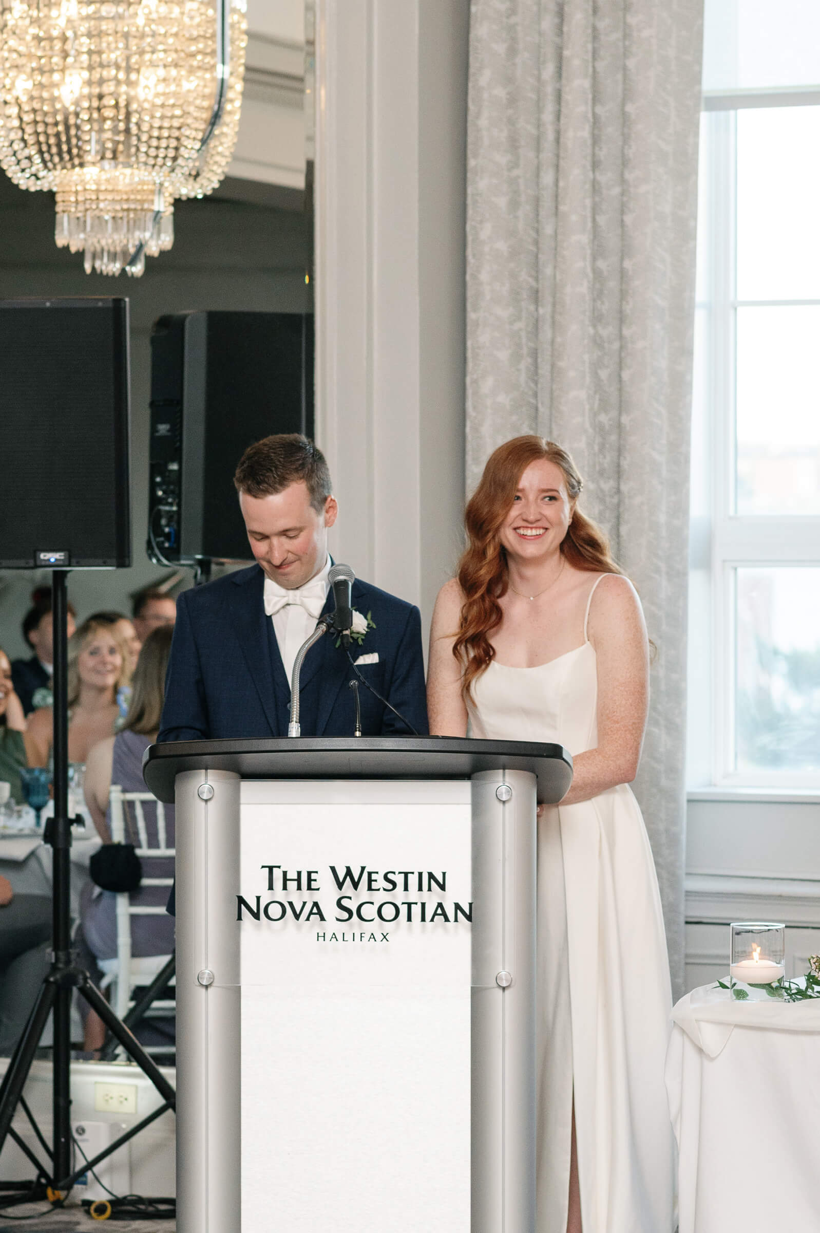 bride and groom give speech at wedding